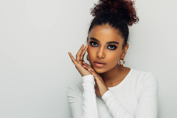 istock Beautiful smiling girl with curly hairstyle 1380224298