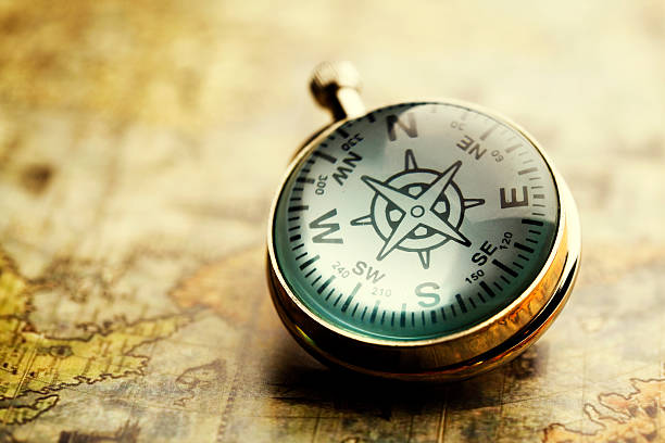 istock Close-up of a compass on a vintage map 138023421
