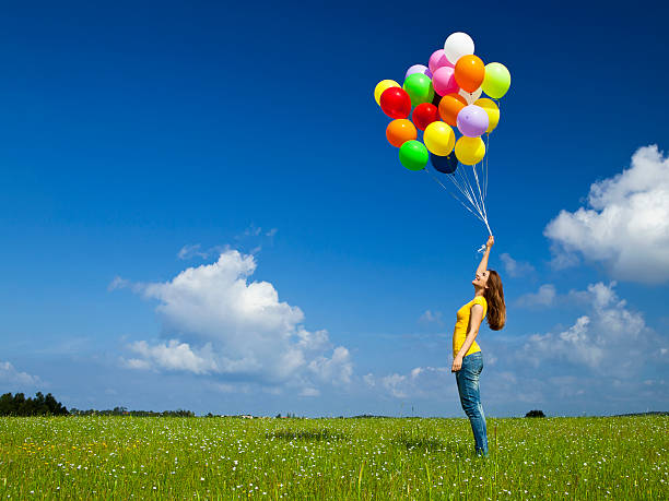 girl with colorful balloons - kvinna ballonger bildbanksfoton och bilder