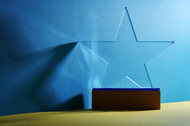 istock crystal star shape trophy against blue and yellow background 1380248560