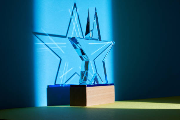 istock crystal star shape trophy against blue and yellow background 1380248565