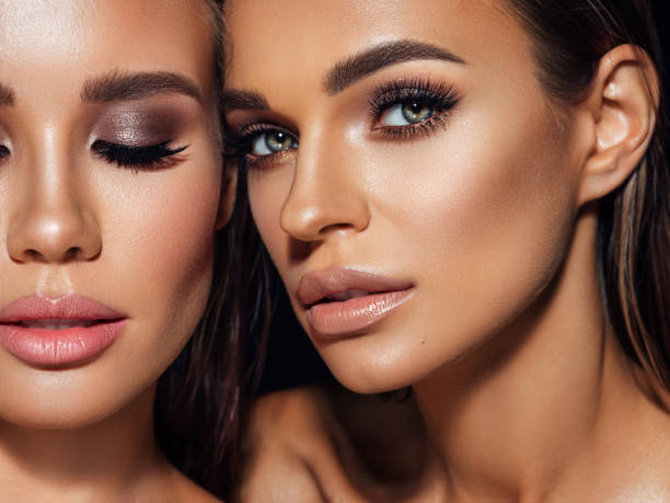 istock Two beautiful emotional women with perfect make-up 1380249108