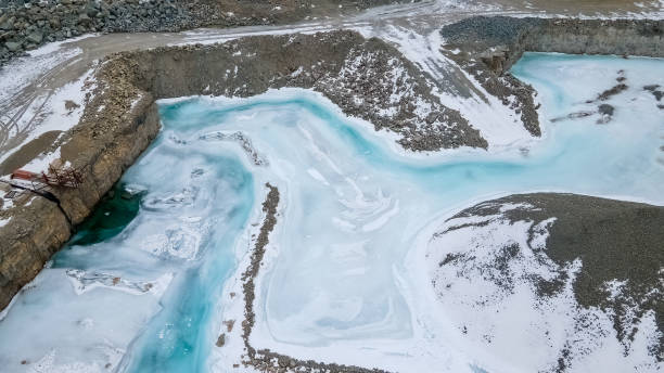 istock Frozen standing water at a rock quarry 1380258011
