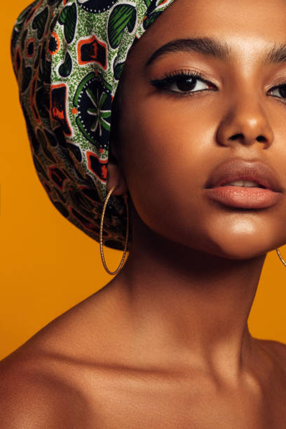 istock African woman with a colorful shawl on her head 1380259594