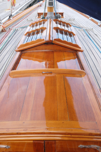 Close-up of a restored wooden hatch on a classic British sailing yacht.