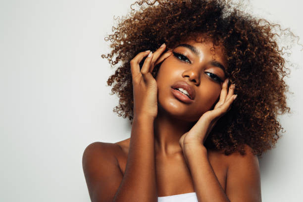 istock Beautiful afro girl with curly hairstyle 1380263838