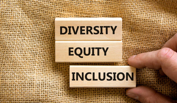 Diversity equity inclusion symbol. Concept words diversity equity inclusion on blocks on beautiful canvas table canvas background. Businessman hand. Business, diversity equity inclusion concept. stock photo