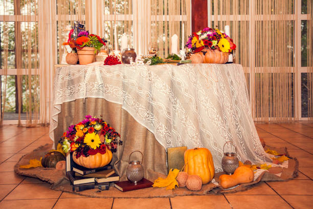 autumn rustic wedding decor with flowers on the table of the bride and groom in a restaurant at a festive banquet - burlap canvas home decorating color image imagens e fotografias de stock