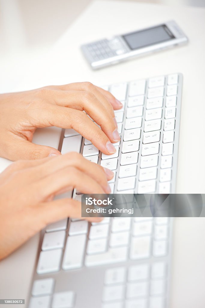 Typing on the keyboard Closeup of a hands typing on the keyboard. Very shallow depth of field. Alphabet Stock Photo