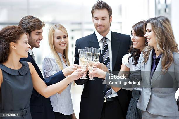 Businesspeople Holding Champagne Glass Stock Photo - Download Image Now - 20-24 Years, 20-29 Years, Achievement