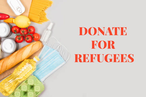 istock Flat lay composition with food and medicines donations on grey background with copyspace - pasta, fresh vegatables, canned food, baguette, cooking oil. Food donations and food bank concept 1380315891