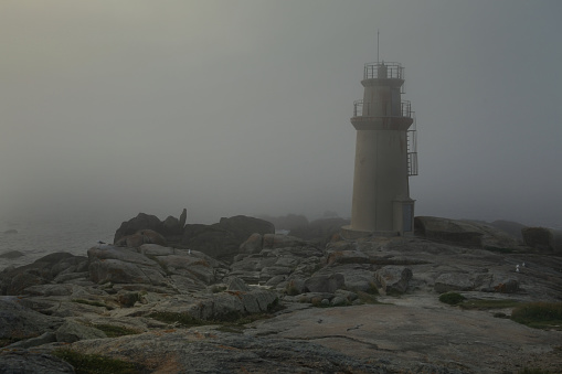 Lighthouse in the city of Muxia, on the huge rocks of the Costa da Morte.