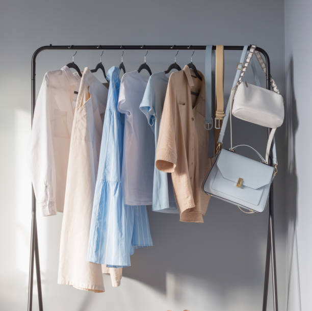 istock light colored womens summer clothes and shoes on  hanger 1380326612