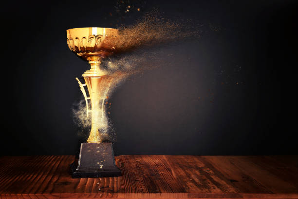 istock image of gold trophy over dark background 1380336284