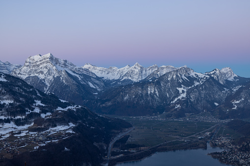 Wonderful sunrise in the Swiss alps with super tones at sky.