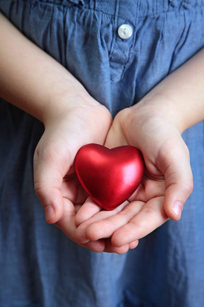 istock Little girl holding heart 138034599