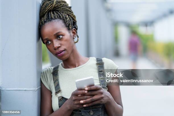 Portrait Of An Young African Woman With Mobile Phone Standing On A Iron Bridge Depression Stock Photo - Download Image Now