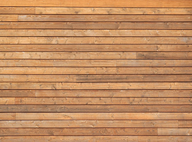 Cedar Siding Cedar siding on building exterior. plank stock pictures, royalty-free photos & images