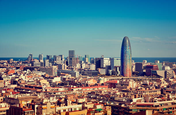 Barcelona`s Financial District Barcelona`s skyline with skyscrapers. cross processed stock pictures, royalty-free photos & images