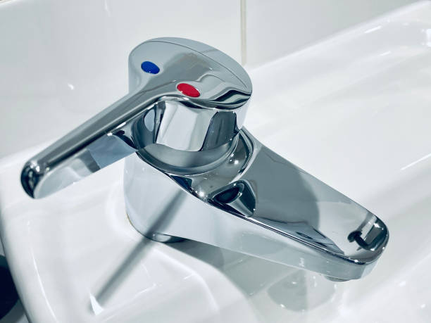 istock Gleaming chrome mixer tap in bathroom 1380377014