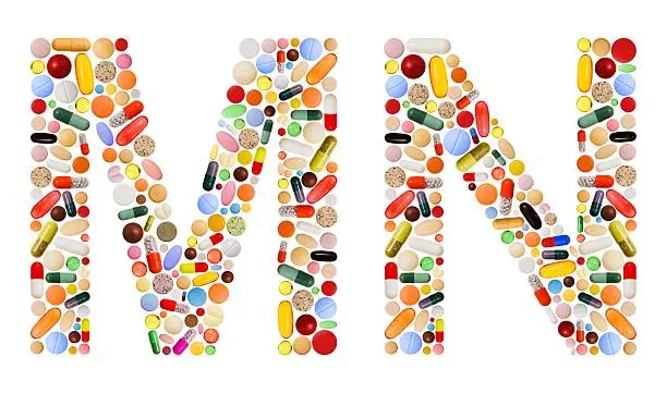 Characters M and N made of various colorful pills, capsules and tablets