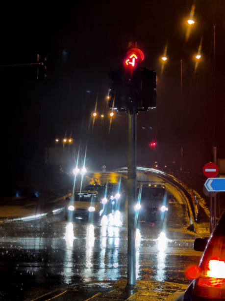 istock road rain night lights car abulance traffic 1380398952