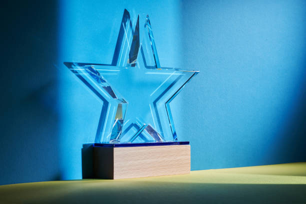 istock crystal star shape trophy against blue and yellow background 1380399037