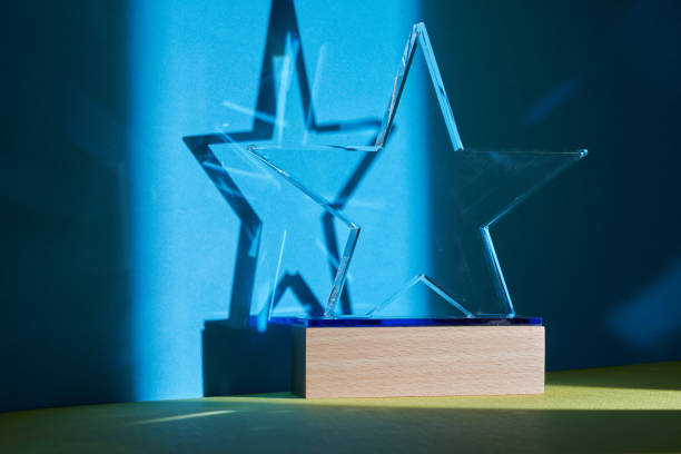 istock crystal star shape trophy against blue and yellow background 1380399038