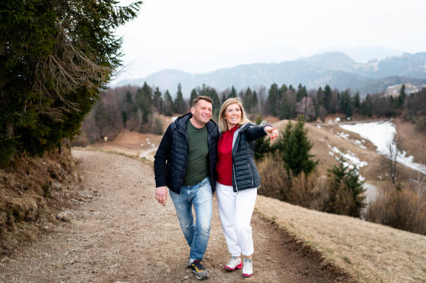 istock Cheerful adult couple in mountains 1380400689