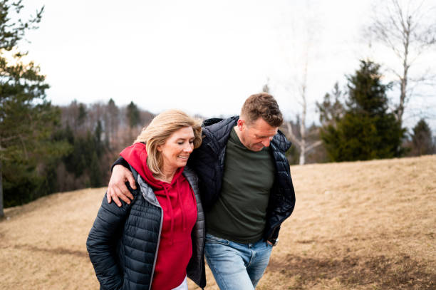 istock Cheerful adult couple in mountains 1380403611