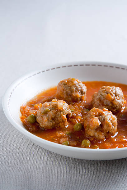 istock Stewed meatballs with peas, tomato and onion. 138040644