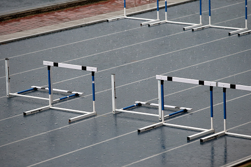 Hurdles fell from the lined up - competitions at track and field stadium delayed due to non-stop rains.