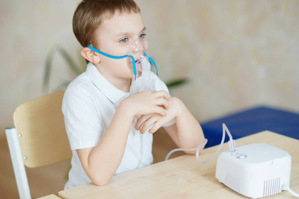 istock Child with inhaler. Nebulizer. Illness. 1380421172