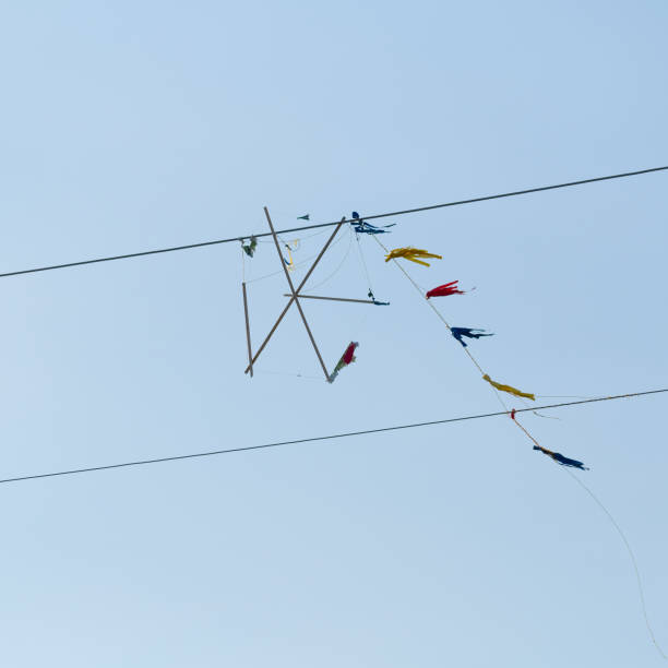 istock Kite caught on electic lines against blue sky, Clean Monday tradition in Greece 1380421752
