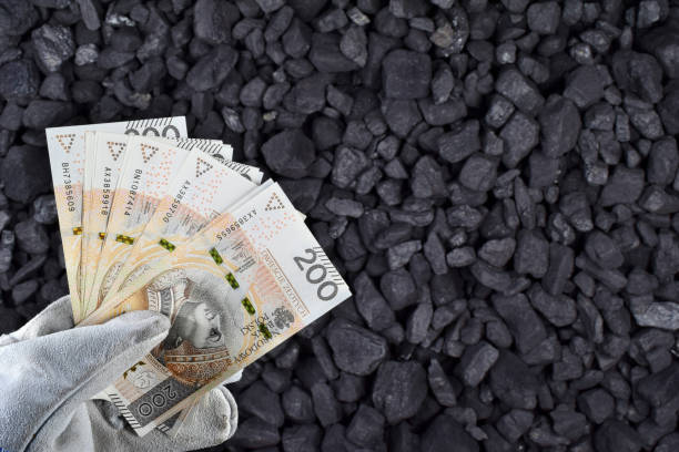 Polish currency showed on coal of mine deposit mineral resources background Polish currency showed on coal of mine deposit mineral resources background whose prices increase during high inflation in Poland polish zloty photos stock pictures, royalty-free photos & images