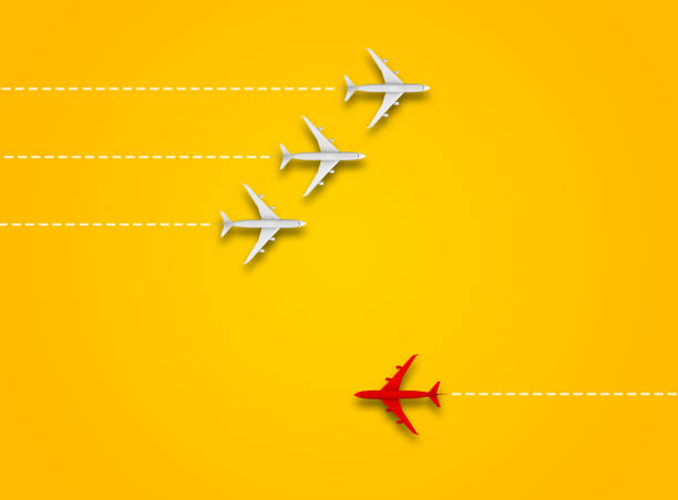 Leadership or different concept with red and white airplane path and route line on orange background. Digital craft in education or travel concept.