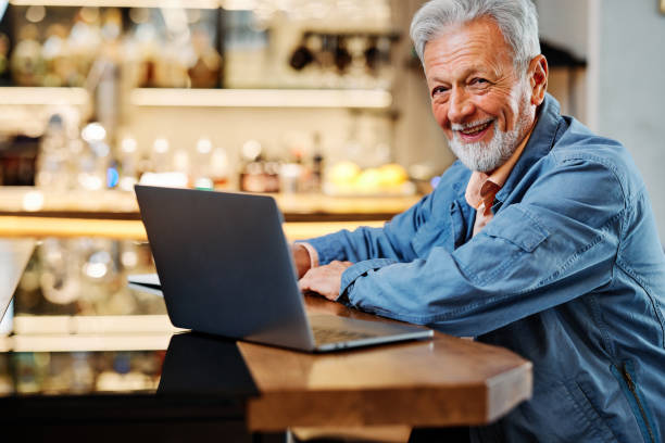 istock The happy senior student is sitting at his home and studying for an exam. Senior using the laptop for studying. 1380454434