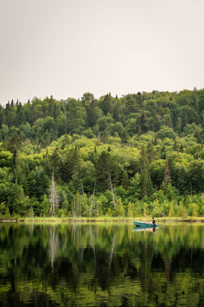 istock A man fishing on a lake in Quebec. 1380467811