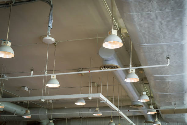 istock Air duct conditioning ceiling in the building and lamp 1380485473