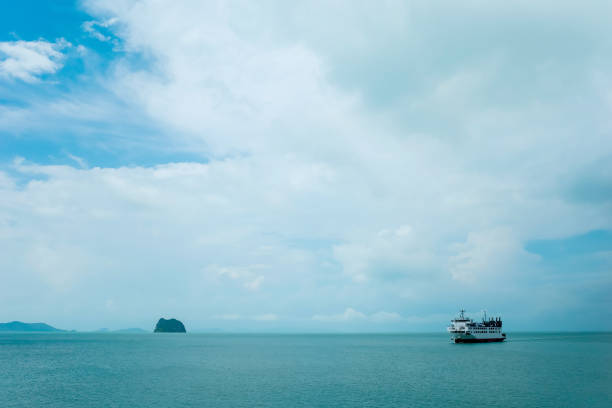 istock blue sky and ferry boat on the island 1380497122
