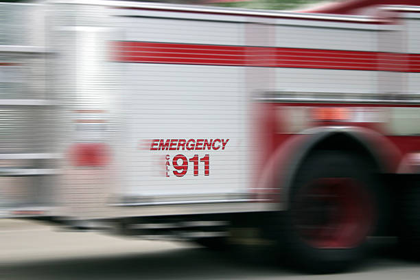 A fire truck speeding past in a blur stock photo