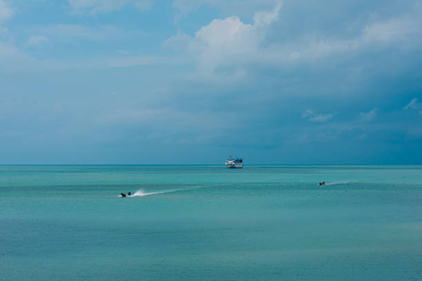Longtail boats and Ferry on the sea.