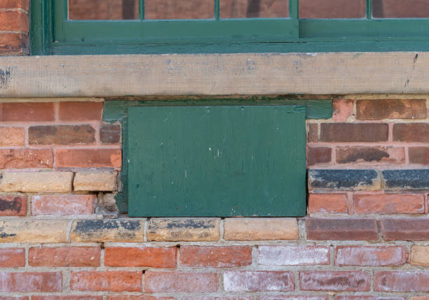 istock Old green window frame on red brick building in the distillery district Toronto Ontario 1380534563