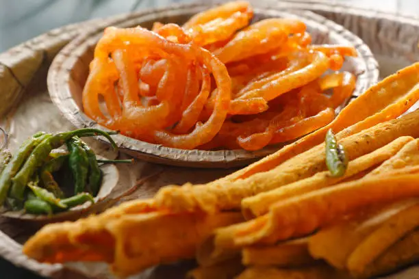 Crispy Fafda with sweet jalebi is an Indian snack most popular in Gujarat, selective focus