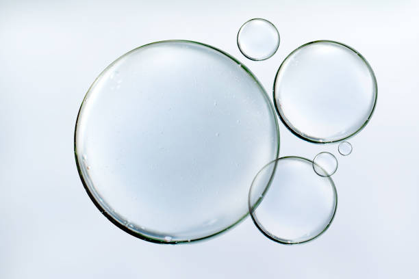 istock Clear water bubbles floats or serum on background 1380542229