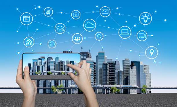 istock Smart city on a digital touch screen mobile phone with different icon. City with infographic elements. Smart city concept design. 1380543599