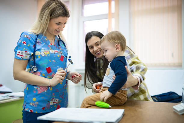 Pediatric checking baby patient with reflex hammer Pediatric checking baby patient with reflex hammer rubber mallet stock pictures, royalty-free photos & images