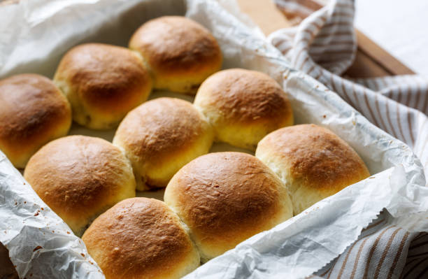 istock Homemade yeast dinner rolls stuffed with rose jam, close up view 1380576557