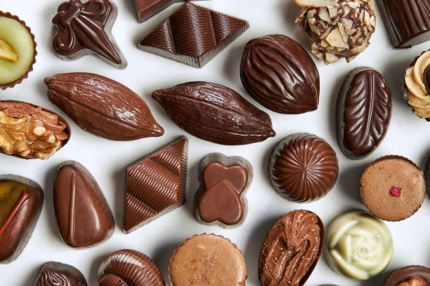 istock Table top view of assorted pralines with milk and dark chocolate 1380595286
