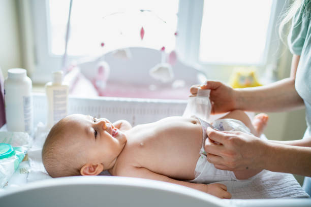 istock Baby in bedroom getting diaper changed 1380606617